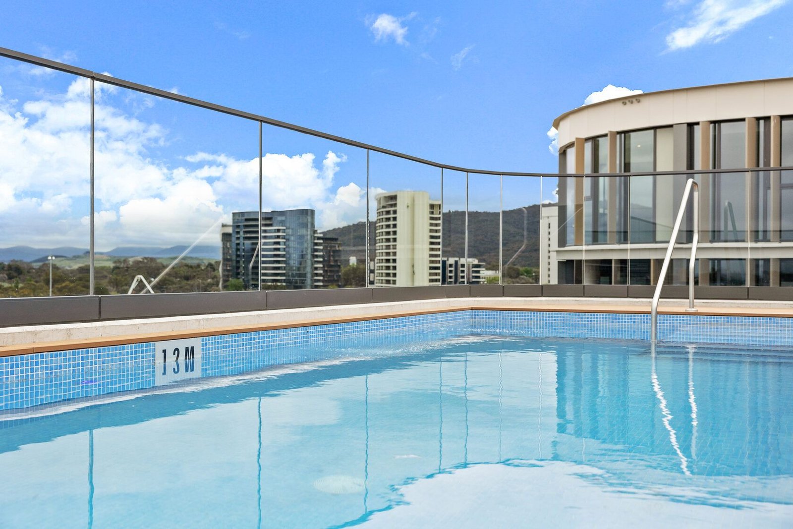 The rooftop pool at The Grande, with views over Canberra